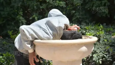 زوار حديقة الأزهر يلجأون للمظلات والنافورات للهروب من حرارة الشمس في ثالث أيام العيد