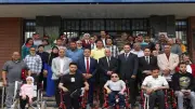 جامعة المنيا توزع 20 لاب توب و5 كراسي كهربائية لدعم ذوي الهمم
