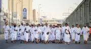 حكم الحج عن شخص والعمرة عن آخر في حج القران: الإفتاء تجيب