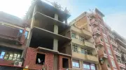 محافظ أسوان يوجه بإزالة بناء مخالف وإشغال رصيف بطريق السادات